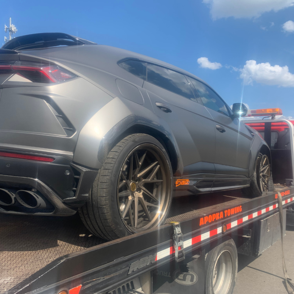 hatchback mazda being towed - towing orange county, fl